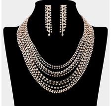 Pierced gold and clear stone multi layered necklace and earring set