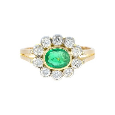 Bicolor Ring mit Smaragd ca. 0,55 ct. und 10 Brillanten ca. 0,50 ct. aus 750