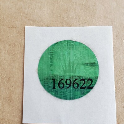 green label on back of rolex