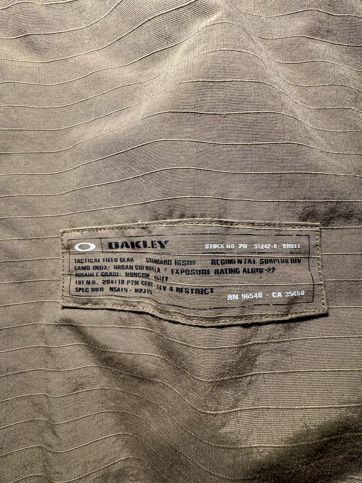 RARO Abrigo Chaqueta OAKLEY De Colección Para Hombre Militar Táctico XL Oliva Bolsillos con Capucha  Foto 4 de 4