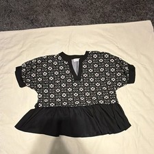 Entro Women’s blouse says small but fits like a large