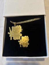 Gold plated matching Hello kitty with machine...