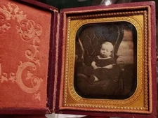sixth plate daguerreotype of a young kid on an elaborate chair full case intact