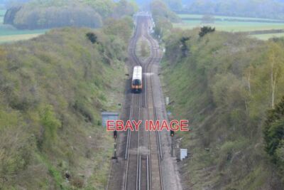 PHOTO  NORTHBOUND TRAIN PASSING BOROUGH DOWN FARM CURRENT OS MAPS SHOW A BRIDGE