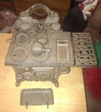 VINTAGE MINIATURE CRESCENT CAST IRON STOVE W/ACCESSORIES. INCOMPLETE