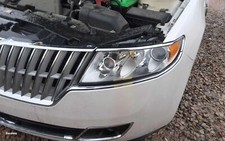 Used Left Headlight Assembly fits: 2010 Lincoln Mkz halogen L. clear background