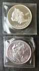 Two 1985 Liberty Lobby 1oz Silver Eagle Rounds in Plastics