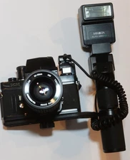 Minolta XK vintage 35mm SLR outfit- 2 lenses, power grip/flash, hot shoe adaptor