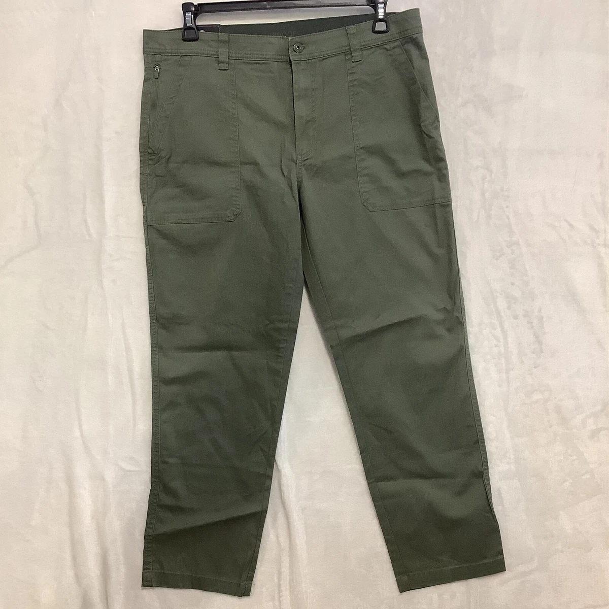 Weatherproof utility pants cell phone pocket top