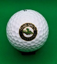 Black and Gold Pebble Beach Golf Links logo golf ball California