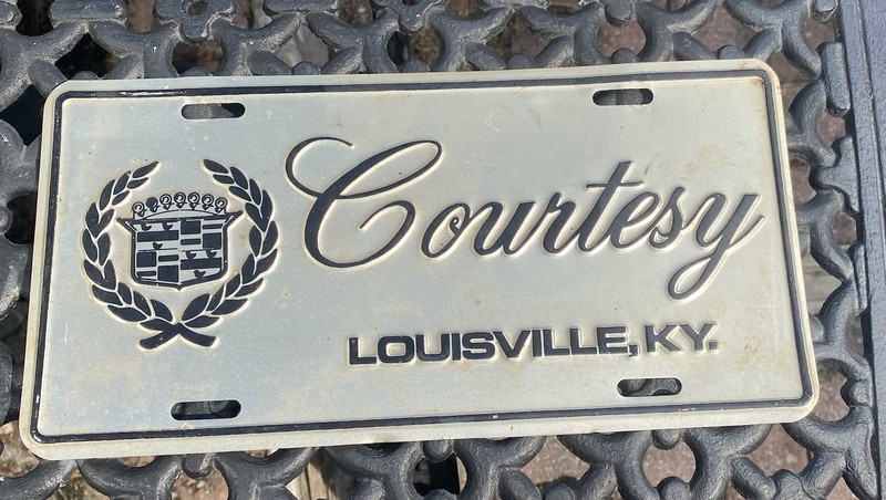 Courtesy Cadillac Booster License Plate Louisville Kentucky Dealer Dealership 