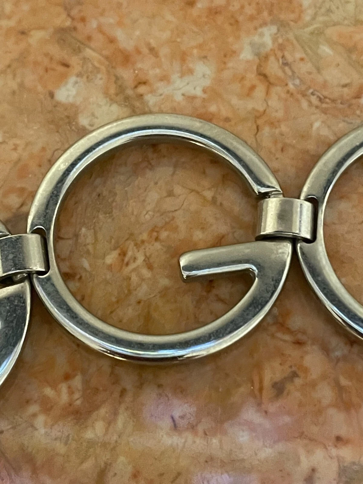 Ceinture chaîne logo GUCCI, design G