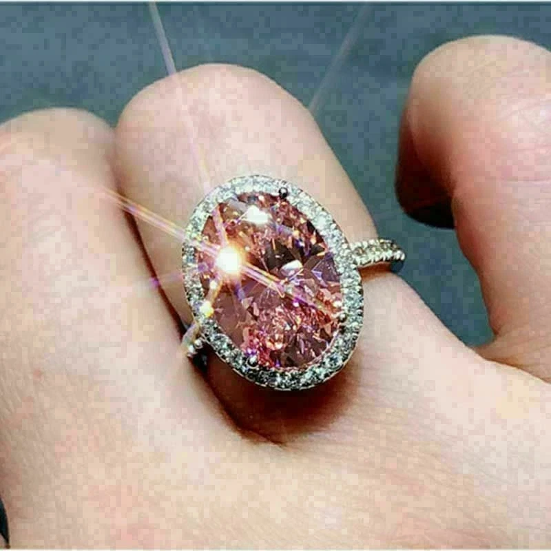 Anillo de compromiso de oro blanco de 14 quilates con halo de zafiro rosa creado en laboratorio ovalado de 3 quilates FN Foto 3 de 4