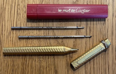 (80) - Must De Cartier - Trinity - Kugelschreiber vergoldet inkl. 2 Ersatzminen