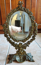 Specchio basculante in bronzo dorato cesellato stile rococò con portaoggetti