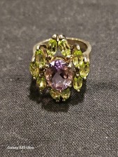 925 SS Plated Flower Ring with 1 Purple and 10 Green Stones Size 6