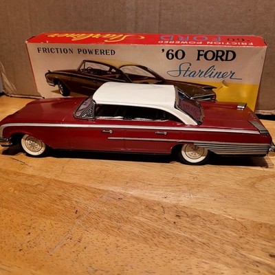 NICE YONEZAWA TIN FRICTION POWERED  1960 FORD  STARLINR HARDTOP WITH BOX