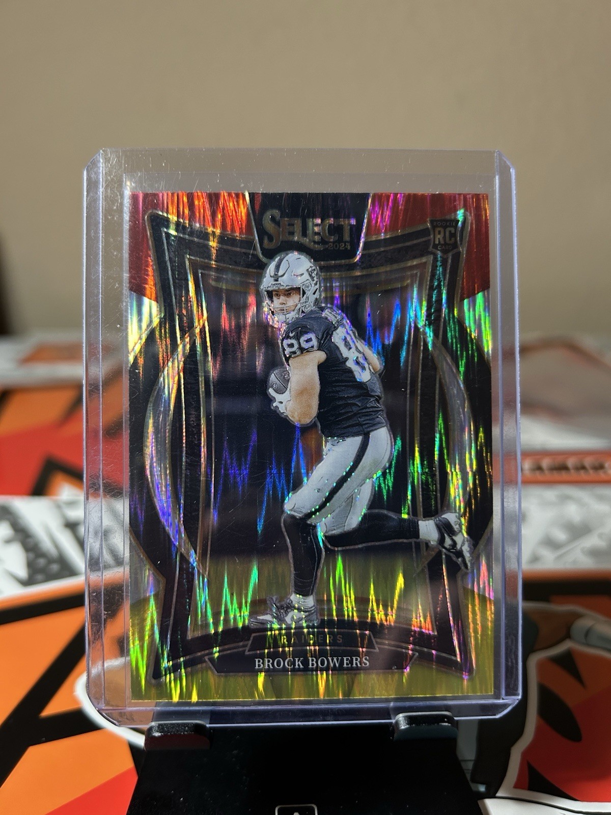 2024 Panini Select - Concourse Brock Bowers #31 Red & Yellow Shock Prizm (RC)