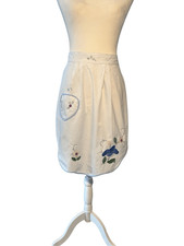White cotton apron with embroidered flowers
