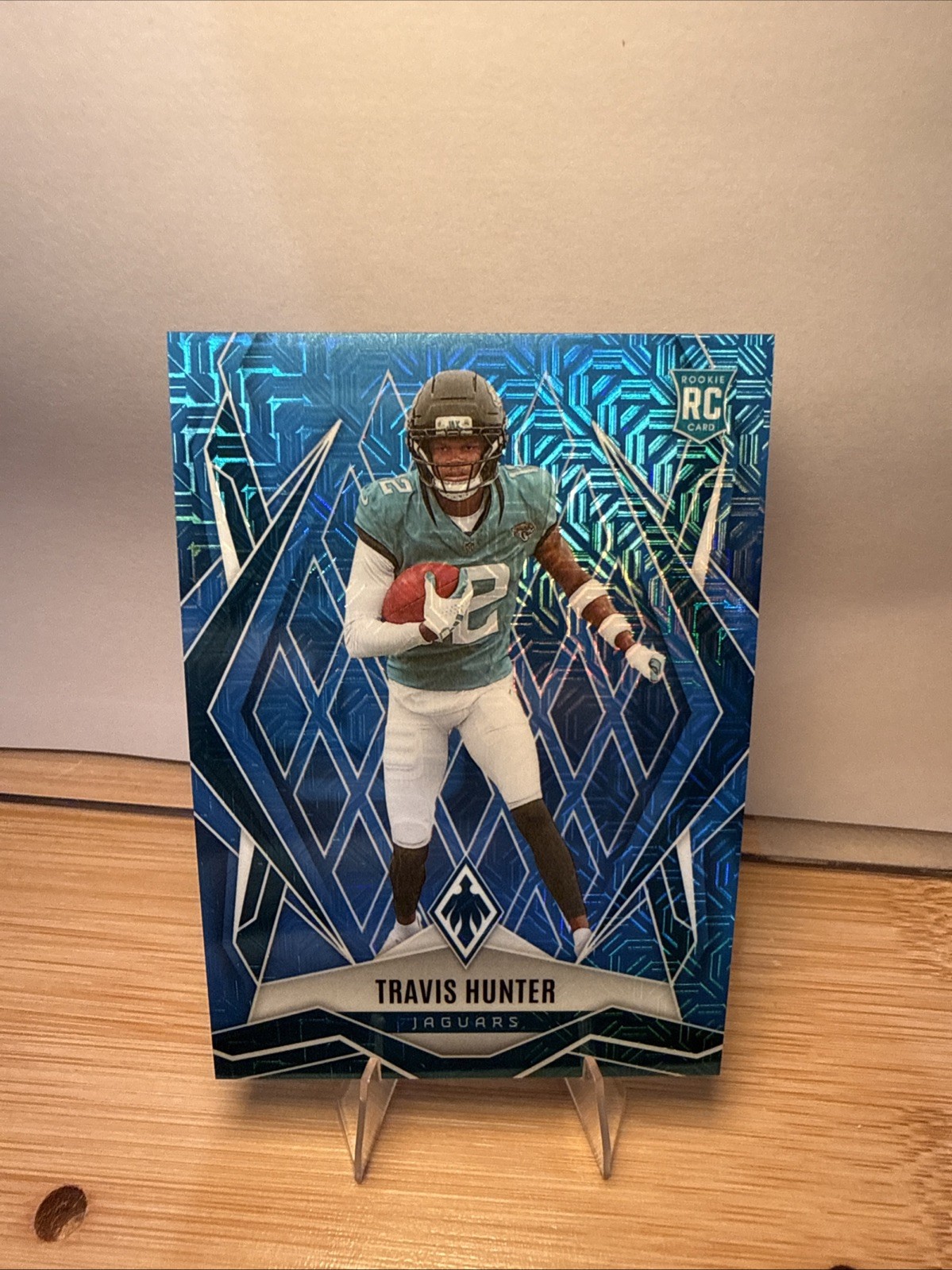 2025 Panini Phoenix - Rookies Travis Hunter #157 Blue Mojo /85 (RC) Jags