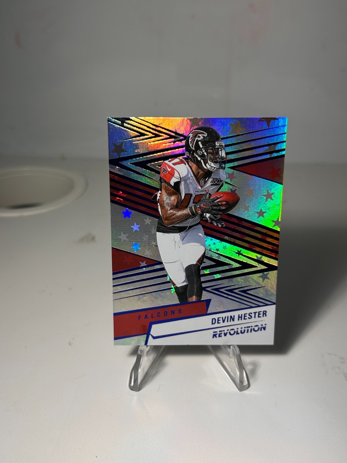 2025 Panini Revolution #77 Devin Hester Blue Astro #/549