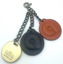 ALLA Handbag Accessory Clip Tag Fob Leather Logo Medallion Black Burnt Orange