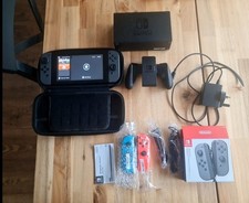 Nintendo SWITCH + ESSENTIALS and CARRYING CASE PLUS EXTRA JOYSTICKS READ DESC