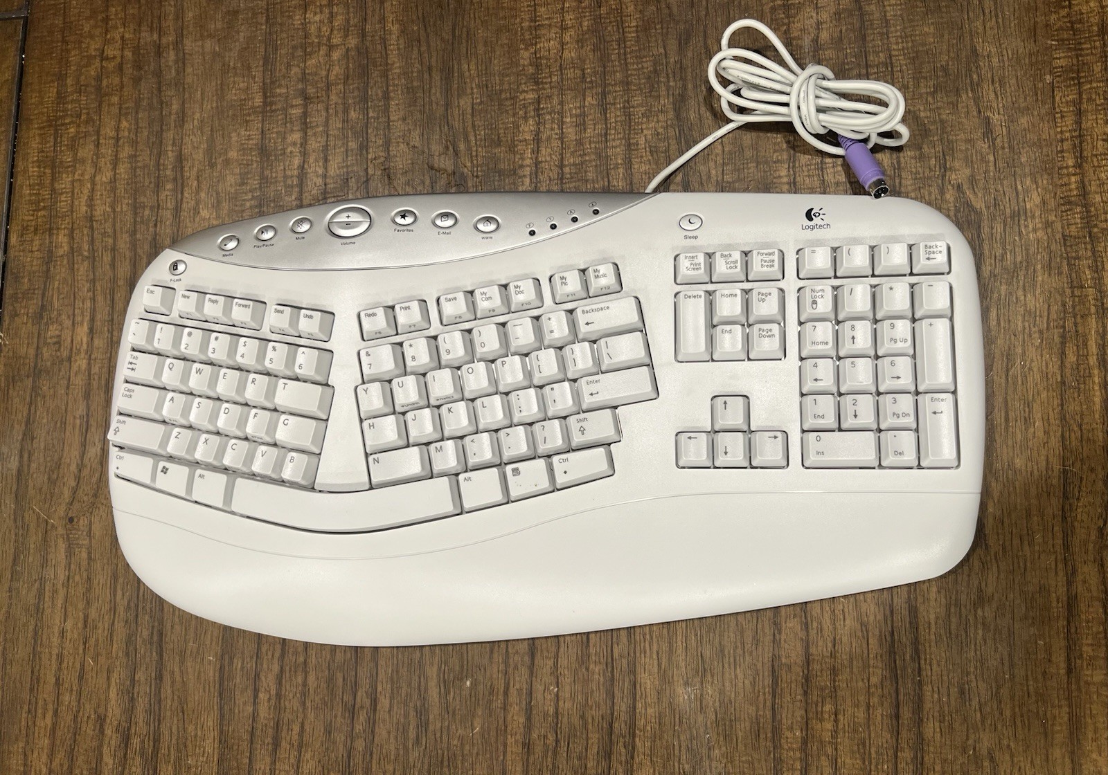 Logitech PS 2 Keyboard Ergonomic Design Office Comfort Y-SY50) (SK-6300)