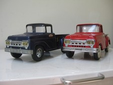 Tonka step side pickups 2 1 red, 1 blue original paint.