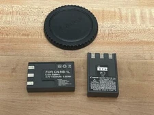 CANON BATTERY CN-NB-1L, CANON BATTERY NB-1LH, AND CANON CAMERA LENS COVER