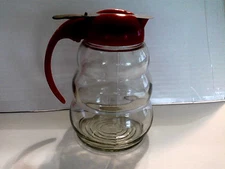 GLASS SYRUP PITCHER RED PLASTIC TOP HANDLE METAL SLIDING LID MADE IN USA