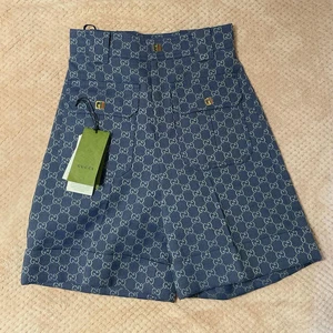 Short GUCCI coton bleu unisexe taille 36 toute saison demi pantalon avec étiquettes