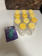 11 Medela Brest Milk Storage Bottles Plus Phillips Avent Binky and breast pump