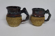PAIR of STUDIO POTTERY MUGS WITH THUMB REST BLUE/BROWN SIGNED ? WILLIAMS ?