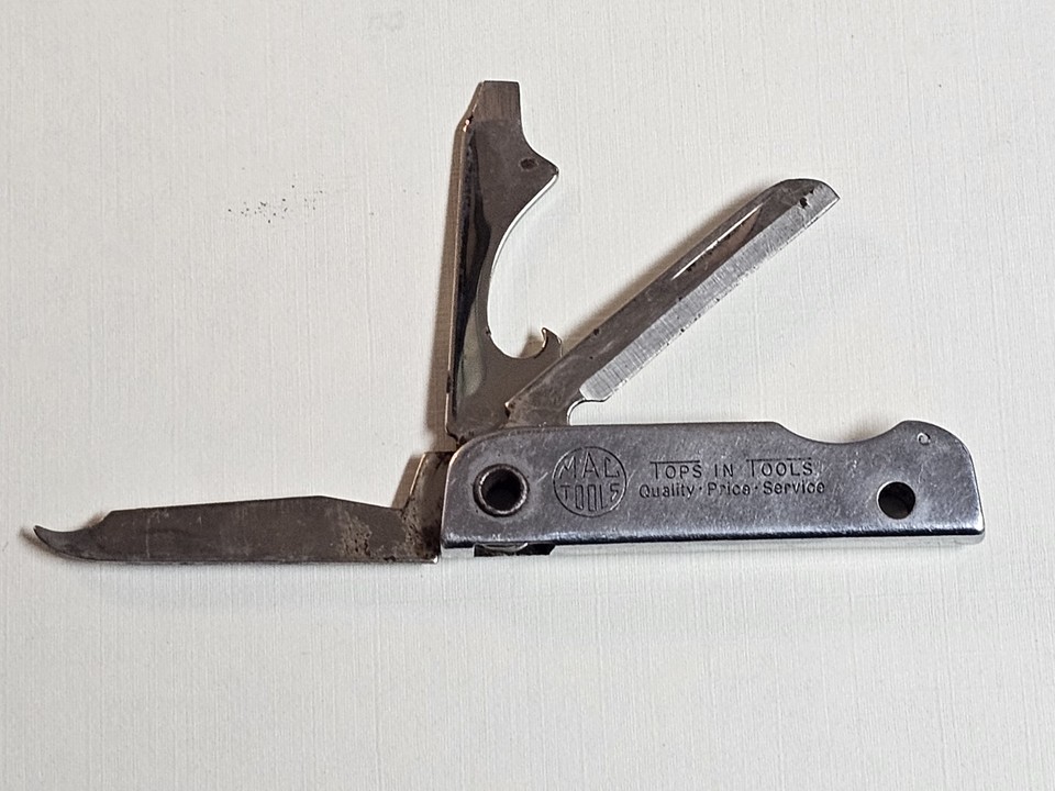 A genuine USA-made vintage advertising pocket knife from Mac Top Tools — a wearable piece of American industrial history that doubles as a functional multi-tool.