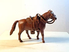 Marx 1950/60's 60mm standing horse with original vinyl saddle and reins. Brown.