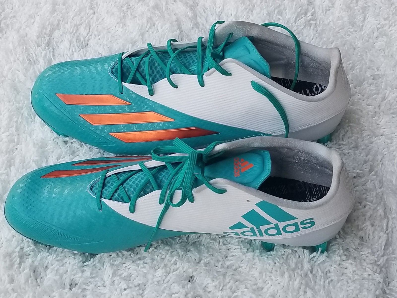 teal football cleats