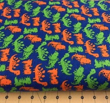Orange Green Dinos on Blue Flannel Fabric Sold By The Yard 2005