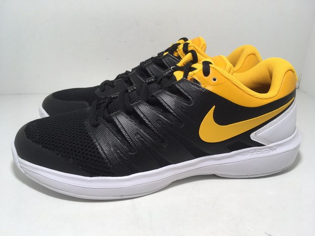 black and yellow nike tennis shoes