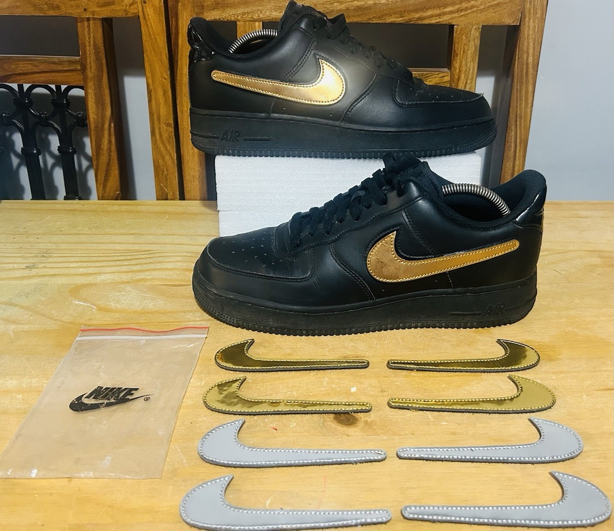 black nike with gold swoosh