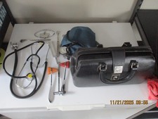 LEATHER SMALL DOCTOR'S BAG WITH INSTRUMENTS.