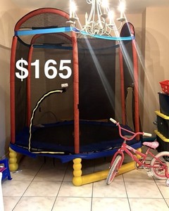 Large Trampoline with Safety net. Regular price $400, asking $165