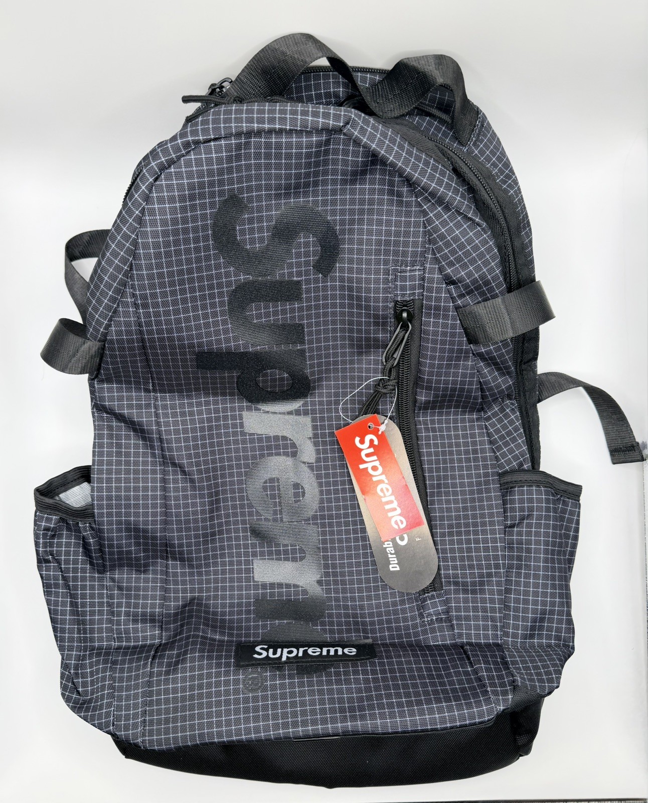 Supreme SS24 Black Backpack with 3M Reflective Material and Embossed Logo