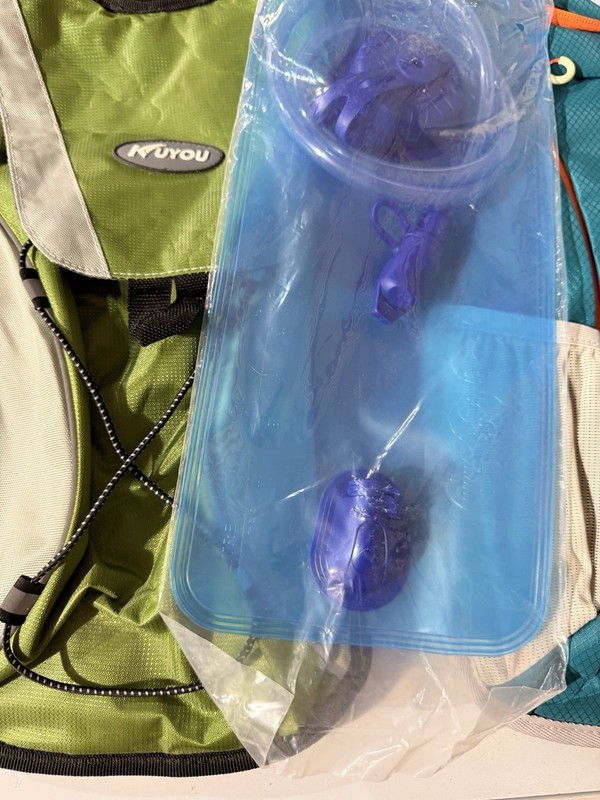 Two New Hydration Packs With one new Water bag in Plastic