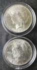 Two 1923 $1 Peace Silver Dollars in Capsules
