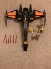 LEGO Star Wars: Poe's X-Wing Fighter (75102) includes book and mini figure