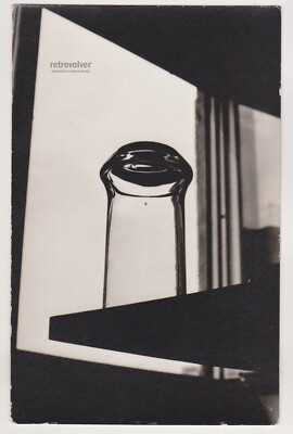 Bottle Caught in Thought: Geometry, Shadows, and Liquid Stillness Abstract Photo