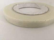 FILAMENT REINFORCED STRAPPING TAPES