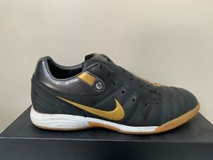 nike gold and black trainers