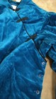 Blue velvet blazer with black Chinese knot accents on front, single button closure, and “Doncaster” label on inner collar.